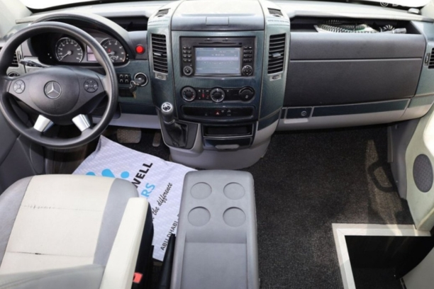 Driver-Friendly Cockpit in Mercedes Sprinter 22 Seater Rental.