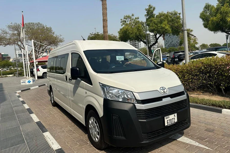 Easy Passenger Entry:
Wide Sliding Door on Toyota Minibus (Right Side)